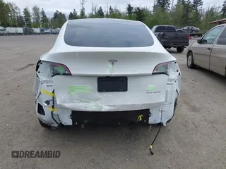 2021 Tesla Model Y Long Range with VIN 5YJYGDEE6MF082883, listed as a IAAI auction lot 42078807 with 64,953 mi miles. Bid and sale history available at carsss.com. Image 6.