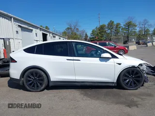 2022 Tesla Model X with VIN 7SAXCDE58NF342776, listed as a IAAI auction lot 42042369 with 70,301 mi miles and . Bid and sale history available at carsss.com. Image 13.