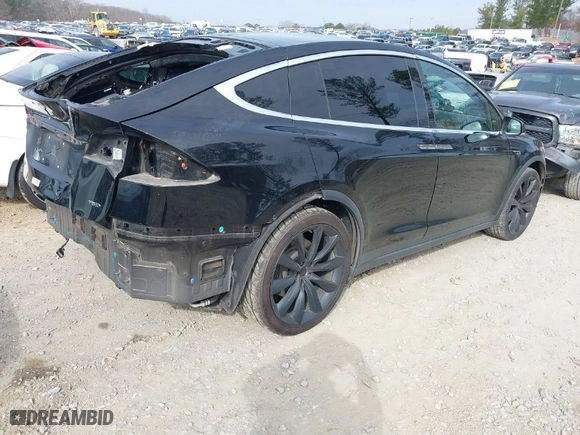 2017 Tesla Model X 90D with VIN 5YJXCBE20HF069506, listed as a IAAI auction lot 41492040 with 145,933 mi miles. Bid and sale history available at carsss.com. Image 4.