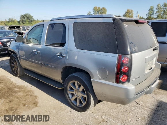 2013 GMC Yukon Denali with VIN 1GKS2EEF0DR311141, listed as a Copart auction lot 74823594 with 125,580 mi miles and Salvage Title. Bid and sale history available at carsss.com. Image 2.
