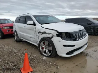 2015 Jeep Grand Cherokee SRT with VIN 1C4RJFDJ8FC919486, listed as a Copart auction lot 76821994 with 114,944 mi miles and Salvage Title. Bid and sale history available at carsss.com. Image 4.