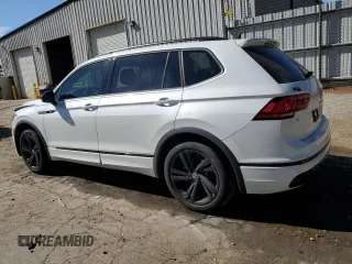 2023 Volkswagen Tiguan SE R-Line Black with VIN 3VVCB7AX6PM001044, listed as a Copart auction lot 47365565 with 20,059 mi miles and Salvage title. Bid and sale history available at DreamBid. Image 2.