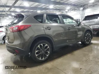 2016 Mazda CX-5 Grand Touring with VIN JM3KE4DY4G0600877, listed as a Copart auction lot 85560194 with 82,395 mi miles and Salvage Title. Bid and sale history available at carsss.com. Image 3.
