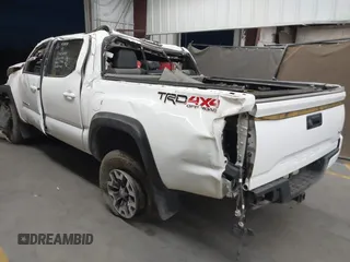 2023 Toyota Tacoma SR with VIN 3TMCZ5ANXPM652495, listed as a IAAI auction lot 42375230 with 26,736 mi miles and . Bid and sale history available at DreamBid. Image 3.