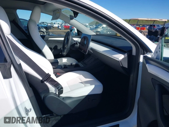 2023 Tesla Model Y Long Range with VIN 7SAYGDEE0PF945202, listed as a IAAI auction lot 41611762 with 7,316 mi miles and . Bid and sale history available at DreamBid. Image 5.