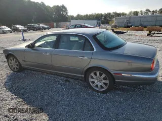 2005 Jaguar XJ with VIN SAJWA79C65SG45989, listed as a Copart auction lot 65357044 with 103,587 mi miles and Salvage Title. Bid and sale history available at carsss.com. Image 2.