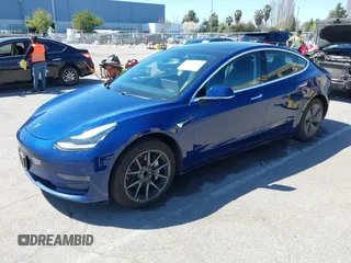 2019 Tesla Model 3 Mid Range with VIN 5YJ3E1EA0KF425079, listed as a IAAI auction lot 41871022 with 61,684 mi miles and . Bid and sale history available at DreamBid. Image 17.
