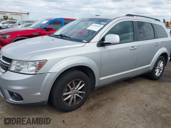 2013 Dodge Journey SXT with VIN 3C4PDDBG4DT571469, listed as a IAAI auction lot 42104433 with 166,068 mi miles and . Bid and sale history available at DreamBid. Image 2.