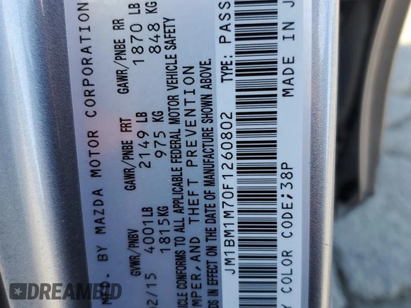 2015 Mazda 3 i Grand Touring z VIN JM1BM1M70F1260802, wystawiony jako Copart lot #60662705 z przebiegiem 89 974 mil mil oraz Szkoda całkowita • Salvage title. Historia ofert i sprzedaży dostępna na DreamBid. Obrazek 12.