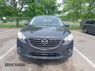 2016 Mazda CX-5 Touring z VIN JM3KE4CY4G0692655, wystawiony jako IAAI lot #42318657 z przebiegiem 212 826 mil mil oraz . Historia ofert i sprzedaży dostępna na DreamBid. Obrazek 12.
