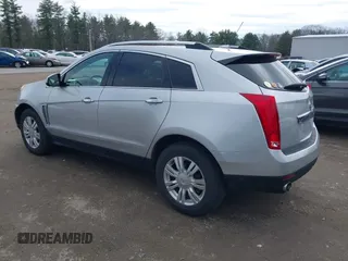 2014 Cadillac SRX Luxury Collection z VIN 3GYFNEE33ES670356, wystawiony jako IAAI lot #42008087 z przebiegiem 59 953 mil mil oraz . Historia ofert i sprzedaży dostępna na DreamBid. Obrazek 3.