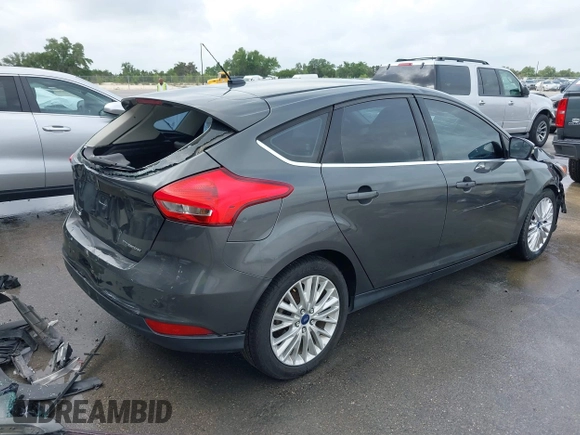 2017 Ford Focus Titanium with VIN 1FADP3N20HL210364, listed as a IAAI auction lot 42130643 with 132,312 mi miles and . Bid and sale history available at DreamBid. Image 4.