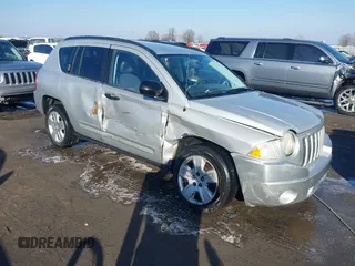 2008 Jeep Compass Sport with VIN 1J8FT47098D665734, listed as a IAAI auction lot 41561801 with 169,446 mi miles. Bid and sale history available at carsss.com. Image 1.