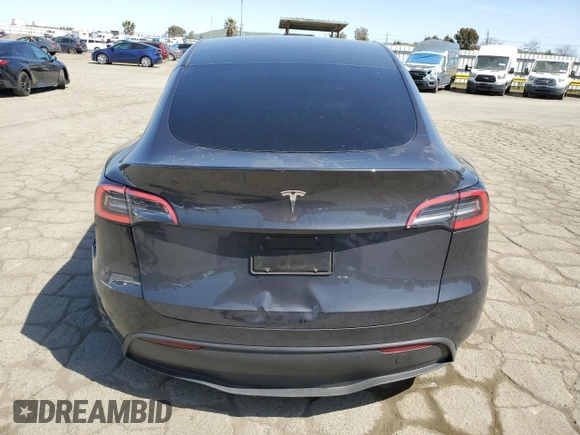 2025 Tesla Model Y Long Range with VIN 7SAYGDED4SF240354, listed as a Copart auction lot 52049745 with 6,785 mi miles and Salvage Title. Bid and sale history available at DreamBid. Image 6.