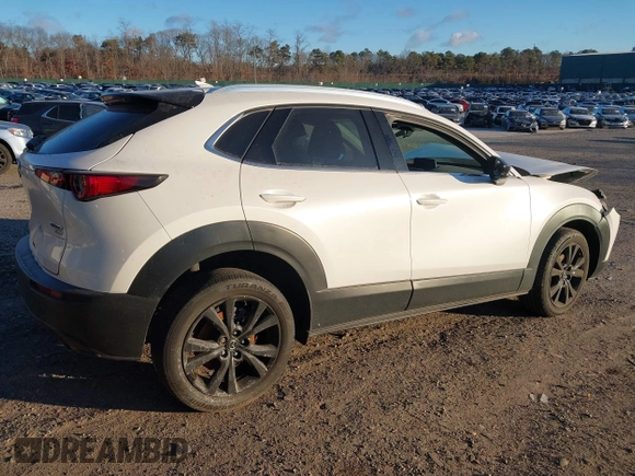 2021 Mazda CX-30 Premium with VIN 3MVDMBDY2MM236118, listed as a IAAI auction lot 41182309 with 32,286 mi miles and . Bid and sale history available at carsss.com. Image 4.