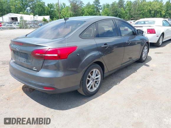 2018 Ford Focus SE with VIN 1FADP3FE2JL227679, listed as a IAAI auction lot 42296608 with 128,269 mi miles and . Bid and sale history available at DreamBid. Image 4.