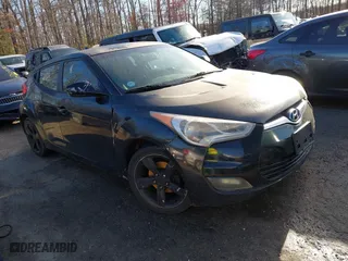 2015 Hyundai Veloster with VIN KMHTC6AD0FU245001, listed as a IAAI auction lot 41881391 with 119,873 mi miles. Bid and sale history available at carsss.com. Image 1.