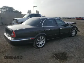 2004 Jaguar XJ with VIN SAJEA71C54SG01455, listed as a Copart auction lot 86591014 with 83,977 mi miles and Salvage Title. Bid and sale history available at carsss.com. Image 3.
