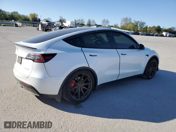 2021 Tesla Model Y Performance with VIN 5YJYGDEF3MF262878, listed as a Copart auction lot 52897595 with 50,939 mi miles and Salvage Title. Bid and sale history available at DreamBid. Image 3.