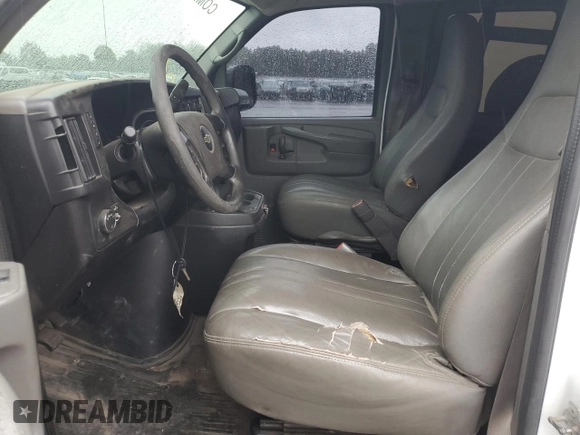 2014 Chevrolet Express Passenger 1LS with VIN 1GAZGZFAXE1105162, listed as a Copart auction lot 72773154 with 97,950 mi miles and Salvage title. Bid and sale history available at DreamBid. Image 7.