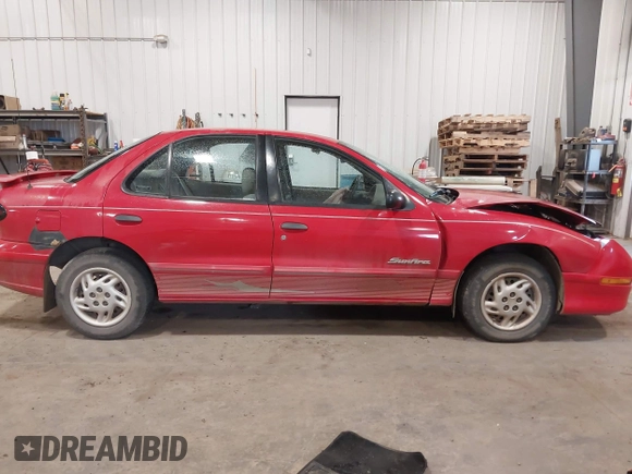 1999 Pontiac Sunfire SE z VIN 1G2JB524XX7547651, wystawiony jako IAAI lot #41962158 z przebiegiem 130 385 mil mil oraz . Historia ofert i sprzedaży dostępna na DreamBid. Obrazek 13.