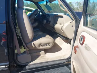 1999 GMC Yukon with VIN 1GKEK13R4XJ762708, listed as a IAAI auction lot 41653291 with 200,240 mi miles. Bid and sale history available at carsss.com. Image 5.