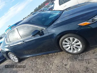 2019 Toyota Camry LE z VIN 4T1B11HK0KU759885, wystawiony jako IAAI lot #41684709 z przebiegiem 80 417 mil mil oraz . Historia ofert i sprzedaży dostępna na DreamBid. Obrazek 13.