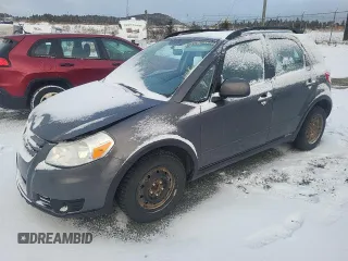 2013 Suzuki SX4 z VIN JS2YA5A34D6100052, wystawiony jako Copart lot #85862654 z przebiegiem 105 114 mil mil oraz Tytuł czysty. Historia ofert i sprzedaży dostępna na DreamBid. Obrazek 1.