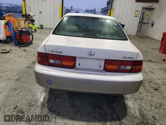 1999 Lexus ES 300 Luxury Sport Sdn with VIN JT8BF28G0X0233986, listed as a Copart auction lot 82440944 with 129,656 mi miles and Salvage Title. Bid and sale history available at carsss.com. Image 6.