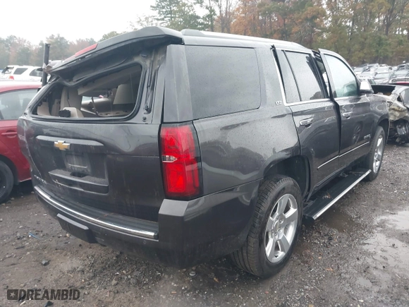 2015 Chevrolet Tahoe LTZ with VIN 1GNSCCKC7FR576236, listed as a IAAI auction lot 40794643 with 170,040 mi miles. Bid and sale history available at carsss.com. Image 4.