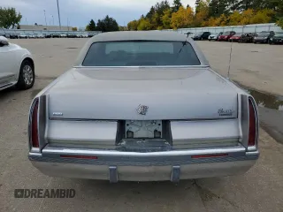 1996 Cadillac Fleetwood z VIN 1G6DW52P6TR702611, wystawiony jako Copart lot #77202664 z przebiegiem 159 994 mil mil oraz Szkody całkowita. Historia ofert i sprzedaży dostępna na DreamBid. Obrazek 6.