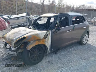 2013 MINI Cooper Countryman with VIN WMWZB3C59DWM31642, listed as a IAAI auction lot 40794983 with 1 mi miles. Bid and sale history available at carsss.com. Image 2.