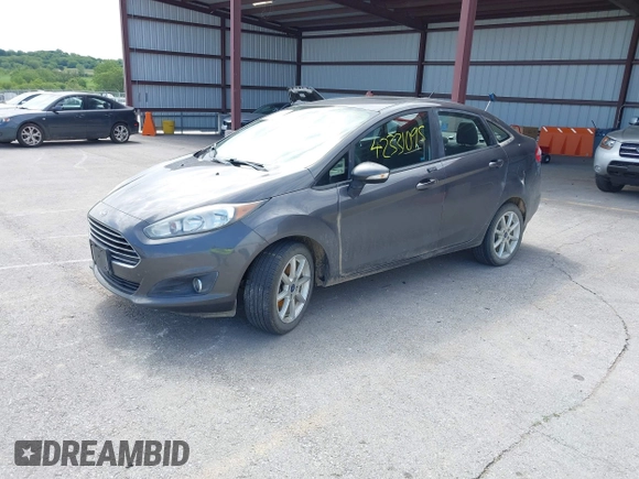 2017 Ford Fiesta SE z VIN 3FADP4BJ2HM134825, wystawiony jako IAAI lot #42331095 z przebiegiem 117 794 mil mil oraz . Historia ofert i sprzedaży dostępna na DreamBid. Obrazek 2.