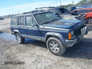1996 Jeep Cherokee z VIN 1J4FT78S5TL148433, wystawiony jako IAAI lot #41722054 z przebiegiem 276 612 mil mil oraz . Historia ofert i sprzedaży dostępna na DreamBid. Obrazek 1.