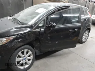2013 Ford Fiesta SE with VIN 3FADP4EJ1DM107945, listed as a IAAI auction lot 42025064 with Not Provided miles and . Bid and sale history available at DreamBid. Image 6.