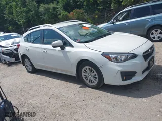 2017 Subaru Impreza Premium with VIN 4S3GTAD67H3748698, listed as a IAAI auction lot 39917558 with 56,945 mi miles. Bid and sale history available at carsss.com. Image 1.