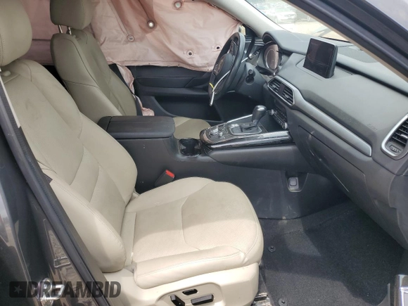 2020 Mazda CX-9 Touring z VIN JM3TCACY3L0411822, wystawiony jako Copart lot #60323295 z przebiegiem 61 348 mil mil oraz Szkoda całkowita • Salvage title. Historia ofert i sprzedaży dostępna na DreamBid. Obrazek 7.
