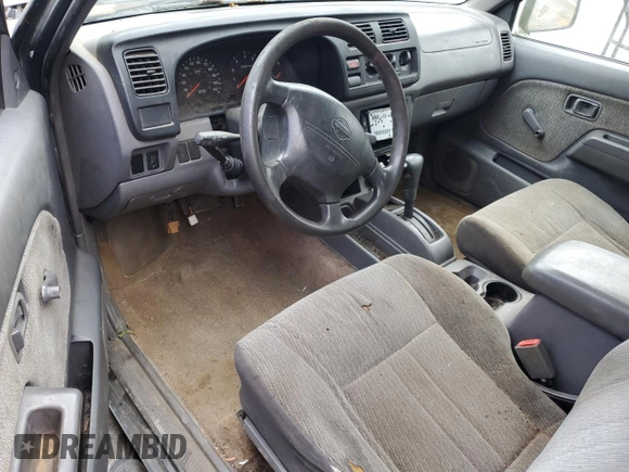 2000 Nissan Frontier XE with VIN 1N6ED27T2YC311037, listed as a Copart auction lot 57901285 with Not provided miles and Salvage title. Bid and sale history available at DreamBid. Image 8.