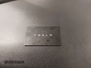 2018 Tesla Model 3 Long Range Battery with VIN 5YJ3E1EB5JF084446, listed as a IAAI auction lot 41209852 with 70,125 mi miles and . Bid and sale history available at DreamBid. Image 11.