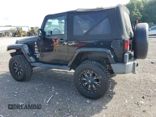 2011 Jeep Wrangler Sahara with VIN 1J4AA5D15BL552185, listed as a Copart auction lot 63065185 with 159,850 mi miles and Salvage title. Bid and sale history available at DreamBid. Image 2.