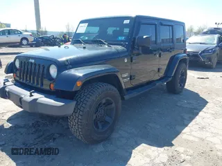 2010 Jeep Wrangler Unlimited Sahara with VIN 1J4HA5H17AL140941, listed as a IAAI auction lot 42004203 with 126,100 mi miles. Bid and sale history available at carsss.com. Image 2.