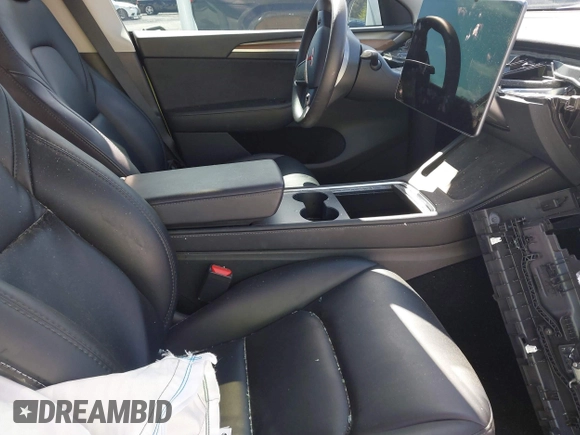 2023 Tesla Model Y Long Range with VIN 7SAYGAEE1PF665934, listed as a IAAI auction lot 41780949 with 21,949 mi miles and . Bid and sale history available at DreamBid. Image 5.