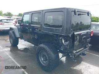 2015 Jeep Wrangler Unlimited Willys Wheeler with VIN 1C4BJWDG4FL687829, listed as a IAAI auction lot 42099147 with 98,969 mi miles and . Bid and sale history available at DreamBid. Image 3.