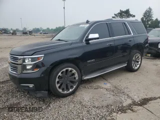 2015 Chevrolet Tahoe LTZ with VIN 1GNSKCKC5FR245710, listed as a Copart auction lot 59619925 with 136,707 mi miles and Clean title. Bid and sale history available at DreamBid. Image 1.