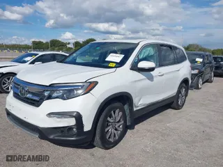 2021 Honda Pilot EX-L with VIN 5FNYF5H55MB039589, listed as a IAAI auction lot 41694567 with 58,685 mi miles. Bid and sale history available at carsss.com. Image 2.