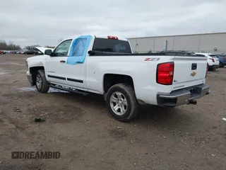 2014 Chevrolet Silverado 1500 LT with VIN 1GCVKREC2EZ390061, listed as a IAAI auction lot 40824477 with 140,928 mi miles and . Bid and sale history available at DreamBid. Image 3.