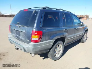 2001 Jeep Grand Cherokee Laredo with VIN 1J4GW48N11C558857, listed as a IAAI auction lot 41527331 with 187,513 mi miles. Bid and sale history available at carsss.com. Image 4.