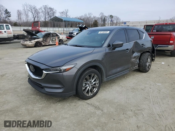 2019 Mazda CX-5 Signature with VIN JM3KFBEY3K0609305, listed as a Copart auction lot 44146455 with 33,104 mi miles and Salvage Title. Bid and sale history available at carsss.com. Image 1.