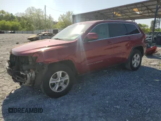 2014 Jeep Grand Cherokee Laredo with VIN 1C4RJEAG7EC274573, listed as a Copart auction lot 52637255 with 156,409 mi miles and Salvage Title. Bid and sale history available at DreamBid. Image 1.