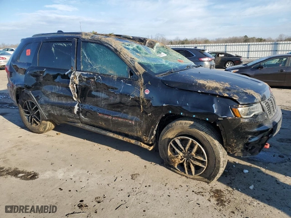 2019 Jeep Grand Cherokee Trailhawk with VIN 1C4RJFLG7KC823624, listed as a Copart auction lot 88843075 with 102,997 mi miles and Salvage Title. Bid and sale history available at carsss.com. Image 4.